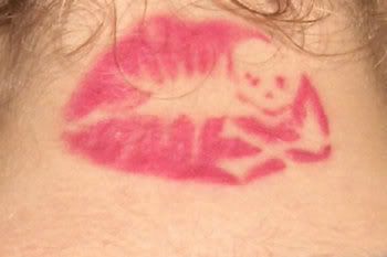 skull in kiss tattoo